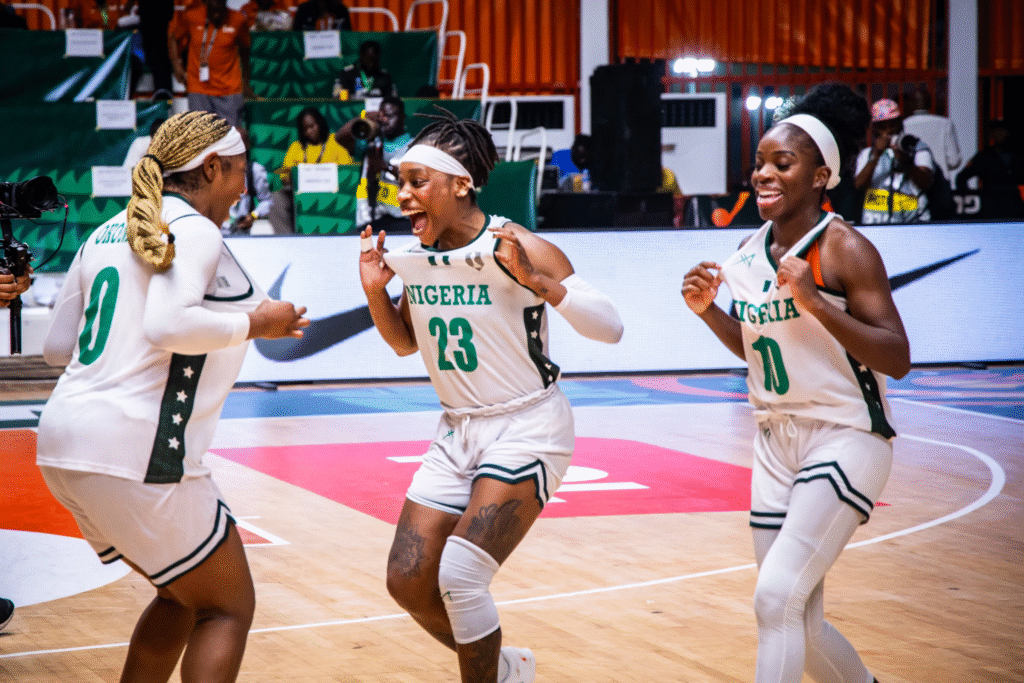 D'Tigress celebrates a win at the 2025 Afrobasket
